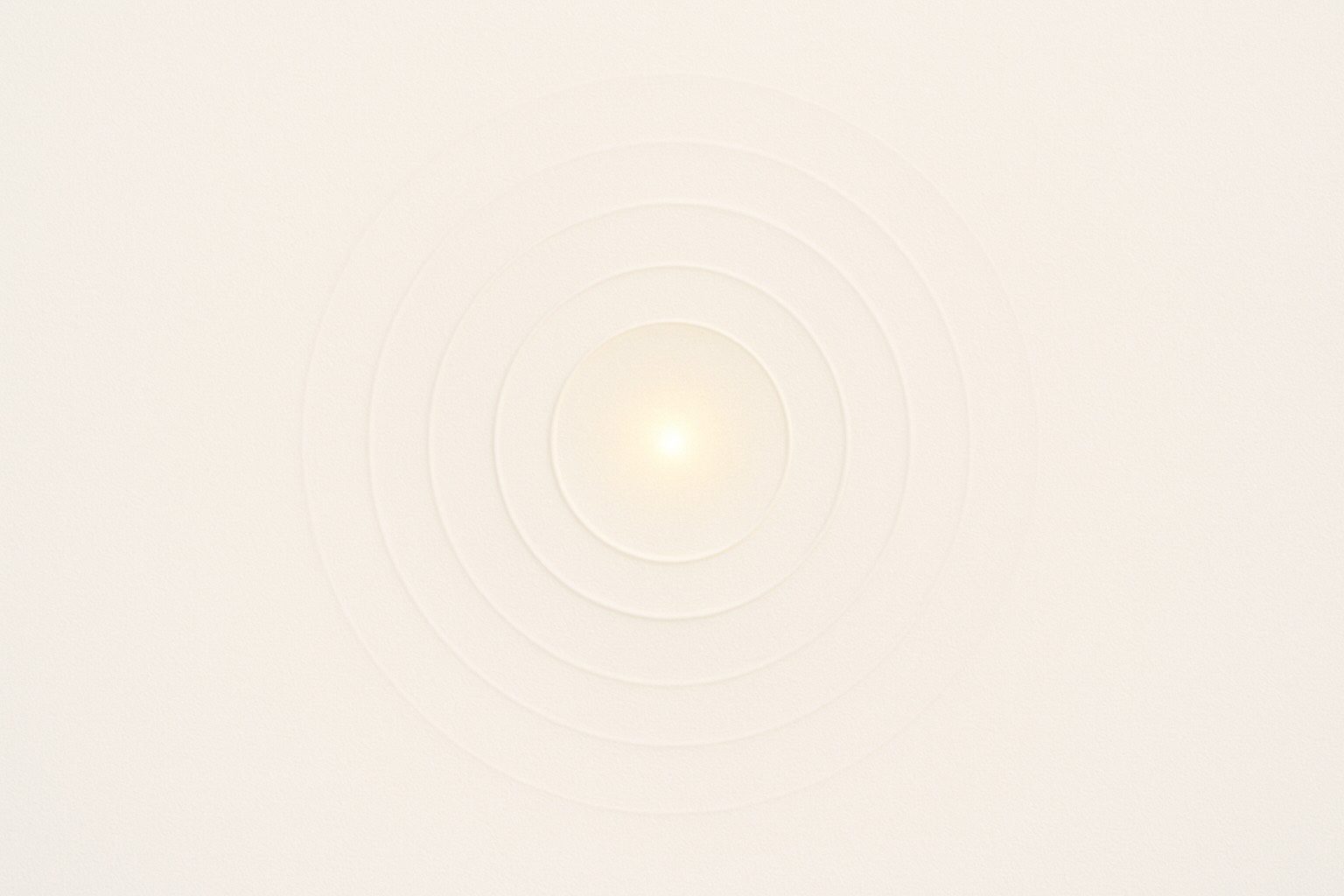 Minimal concentric circles radiating from a central point of light, symbolizing the subtle resonance of bija mantras used for chakra healing.